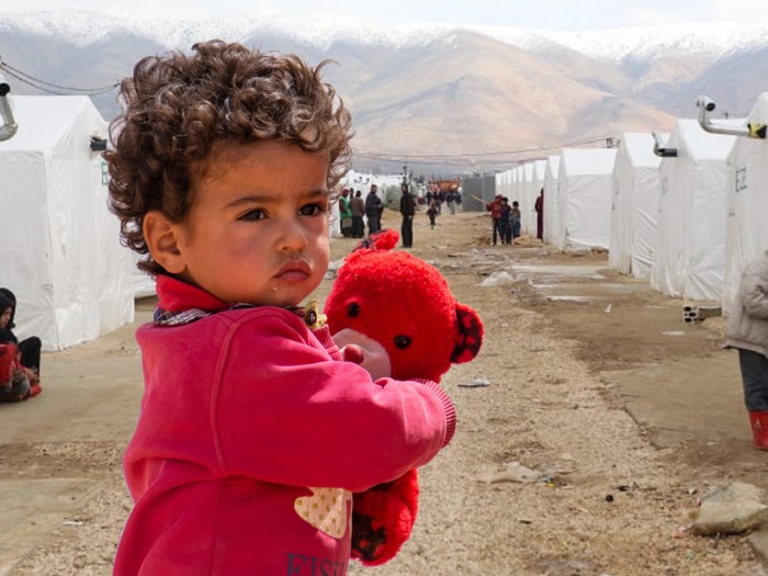 Young orphan child being supported through sponsorship program